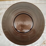 Round flared dish in ribbed brown glass