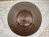 Round flared dish in ribbed brown glass
