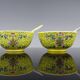 Pair of porcelain bowls and spoons "Famille Rose" China, early 20th century.