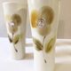 Large ceramic glasses, hand-painted flower pattern, beige/cream tones