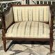 Low armchair in finely carved wood in the Louis XVI style from the 19th century