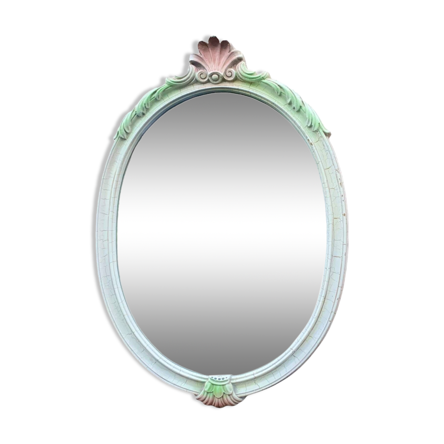 Vintage oval mirror in carved wood in pastel tones