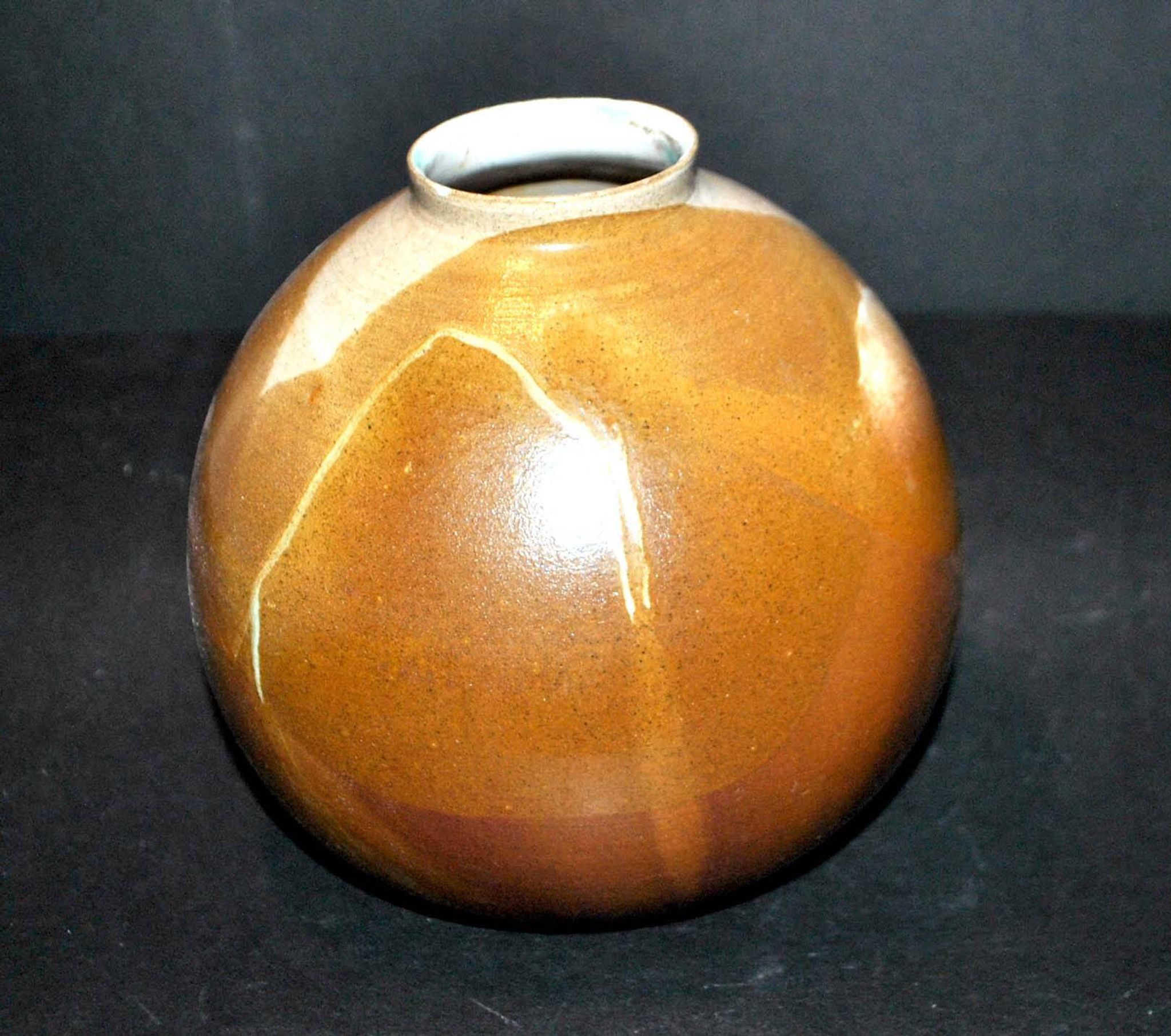 Vintage ball vase in flamed stoneware 1960 - caramel color with blue flow - signed DS