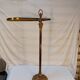 Old golden brass towel rack on baroque style foot