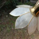 Brass chandelier and flowers in mother-of-pearl petals