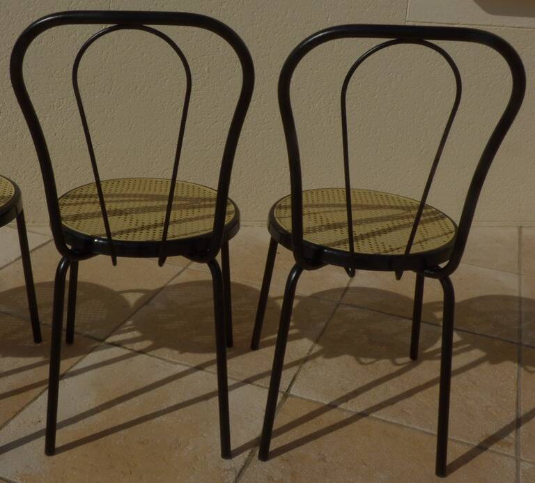 4 Black metal bistro chairs with plastic cane seat