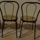 4 Black metal bistro chairs with plastic cane seat