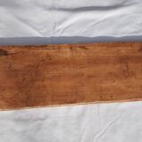 Bas-relief plaster scene of horses and a cart.