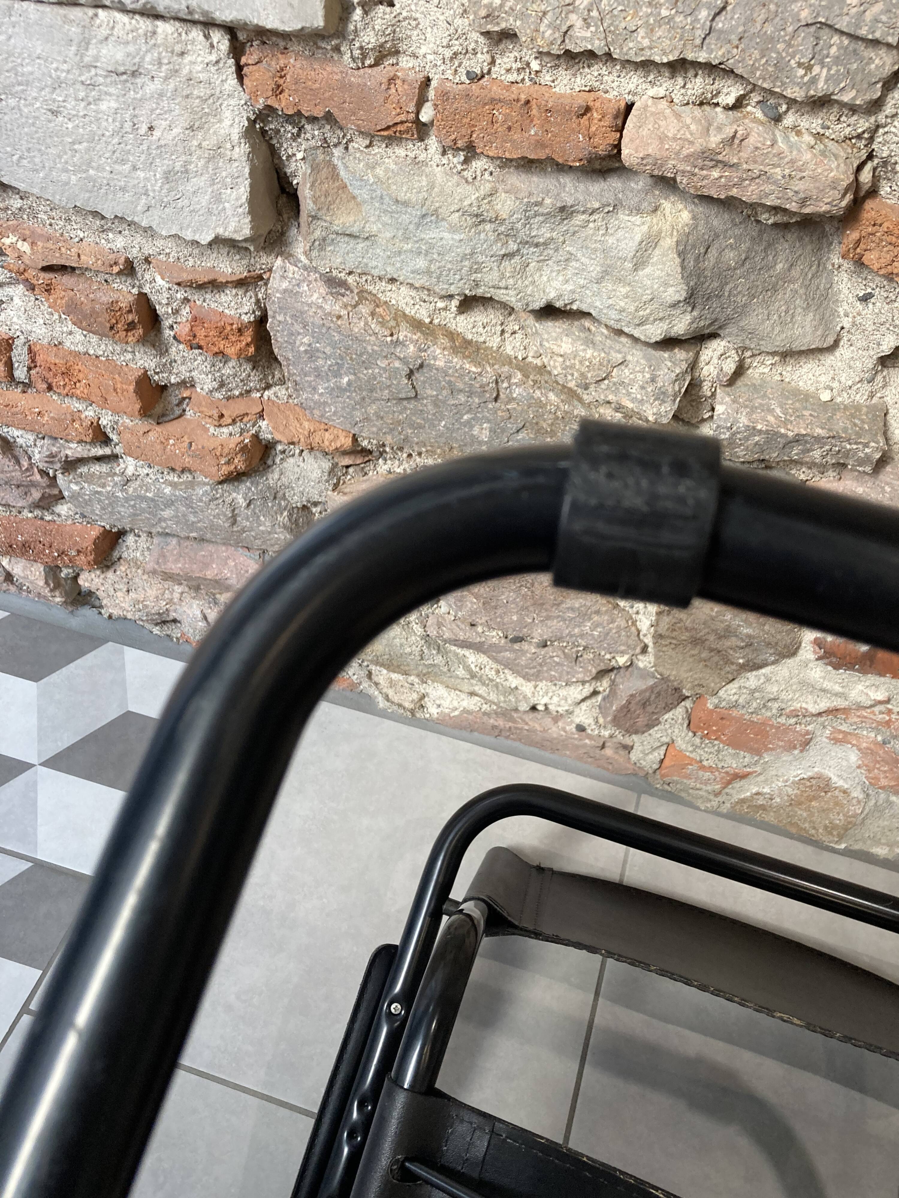 Armchair in black lacquered metal