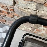 Armchair in black lacquered metal