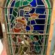 Stained glass panel representing a nineteenth century coronation
