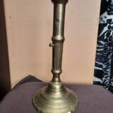 Golden candle holder with old pusher