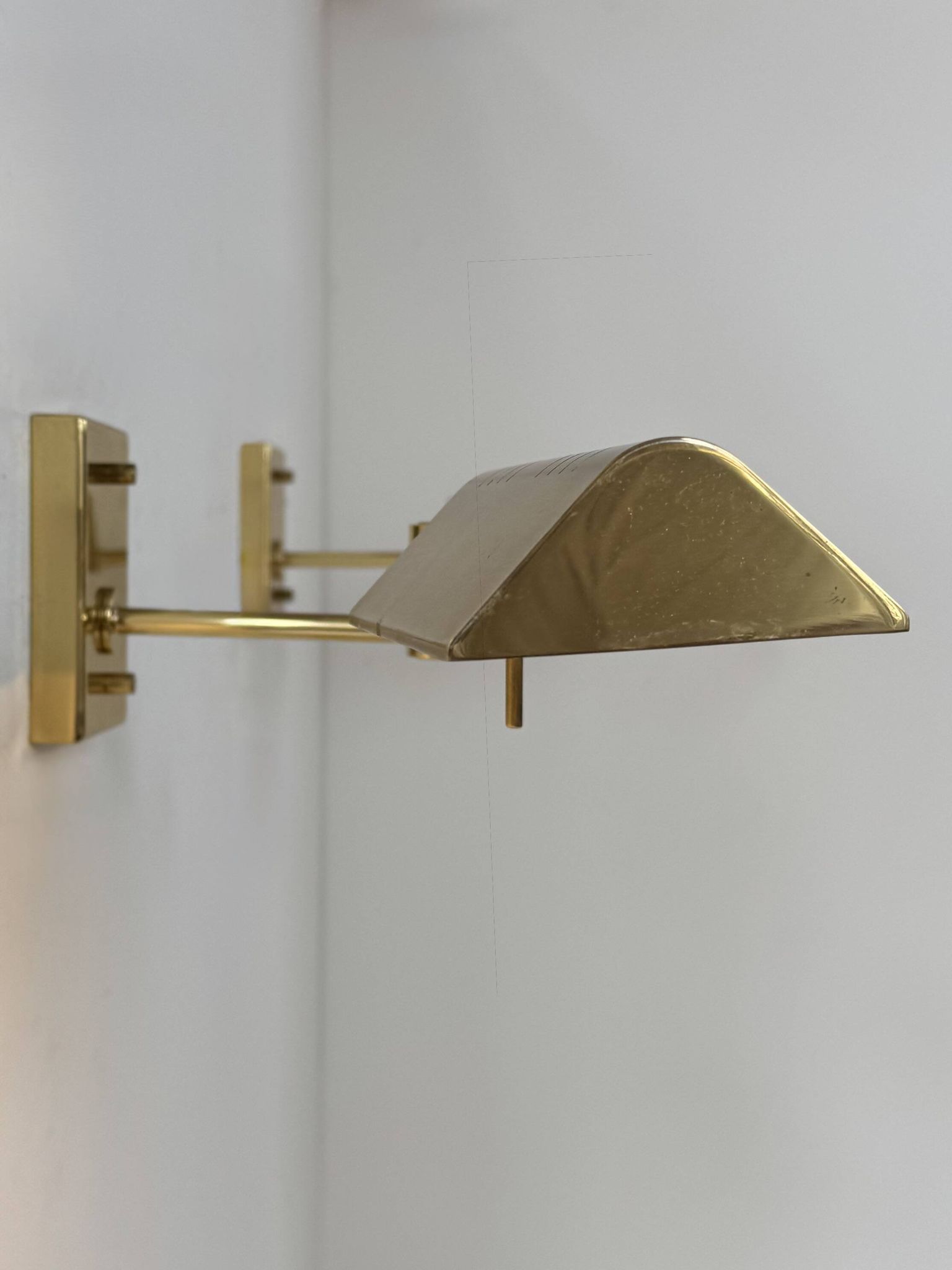 Pair of adjustable vintage wall lights, brass, France, 1970.