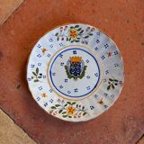 Old plate with coat of arms