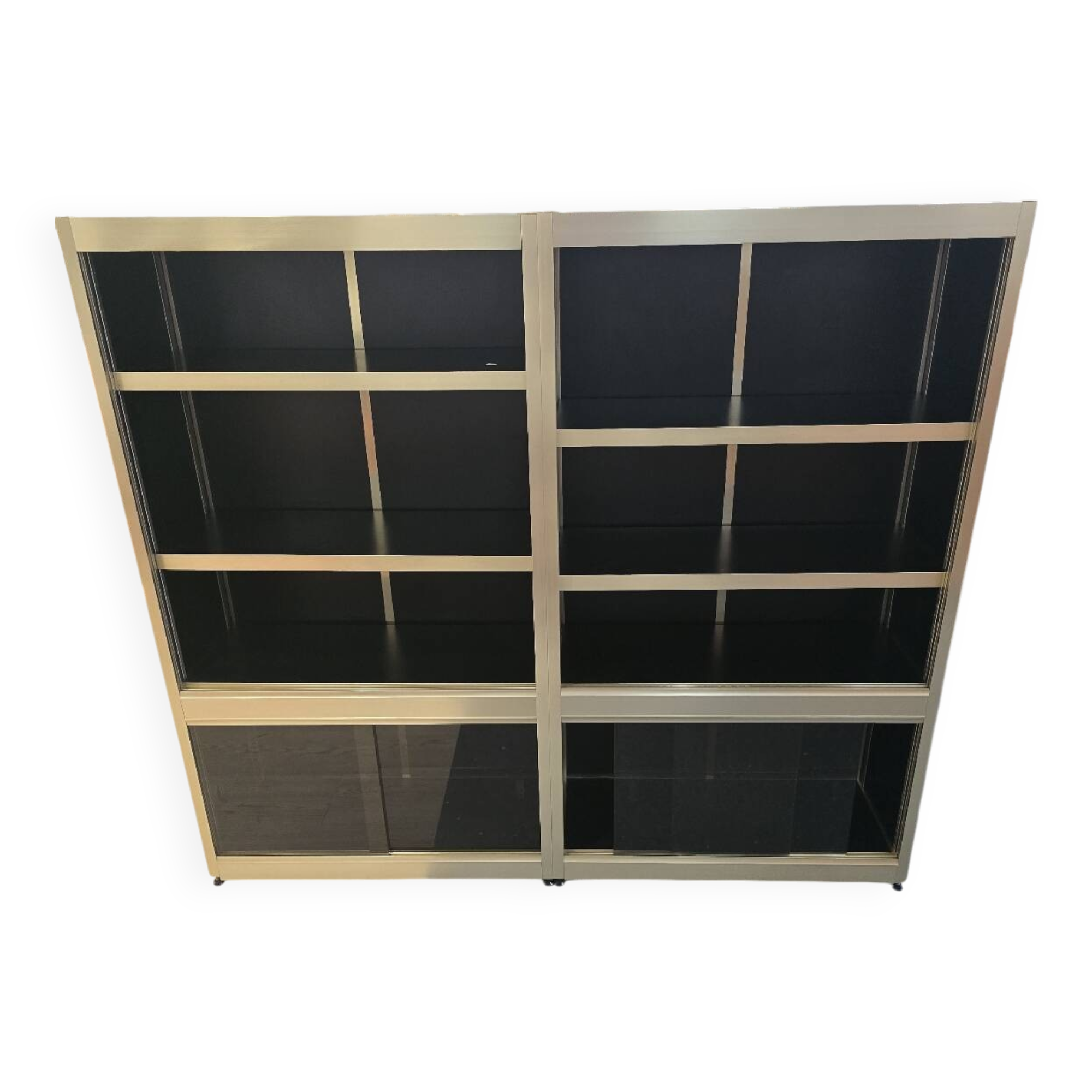 1970s design library with gold metal and lacquered wood.