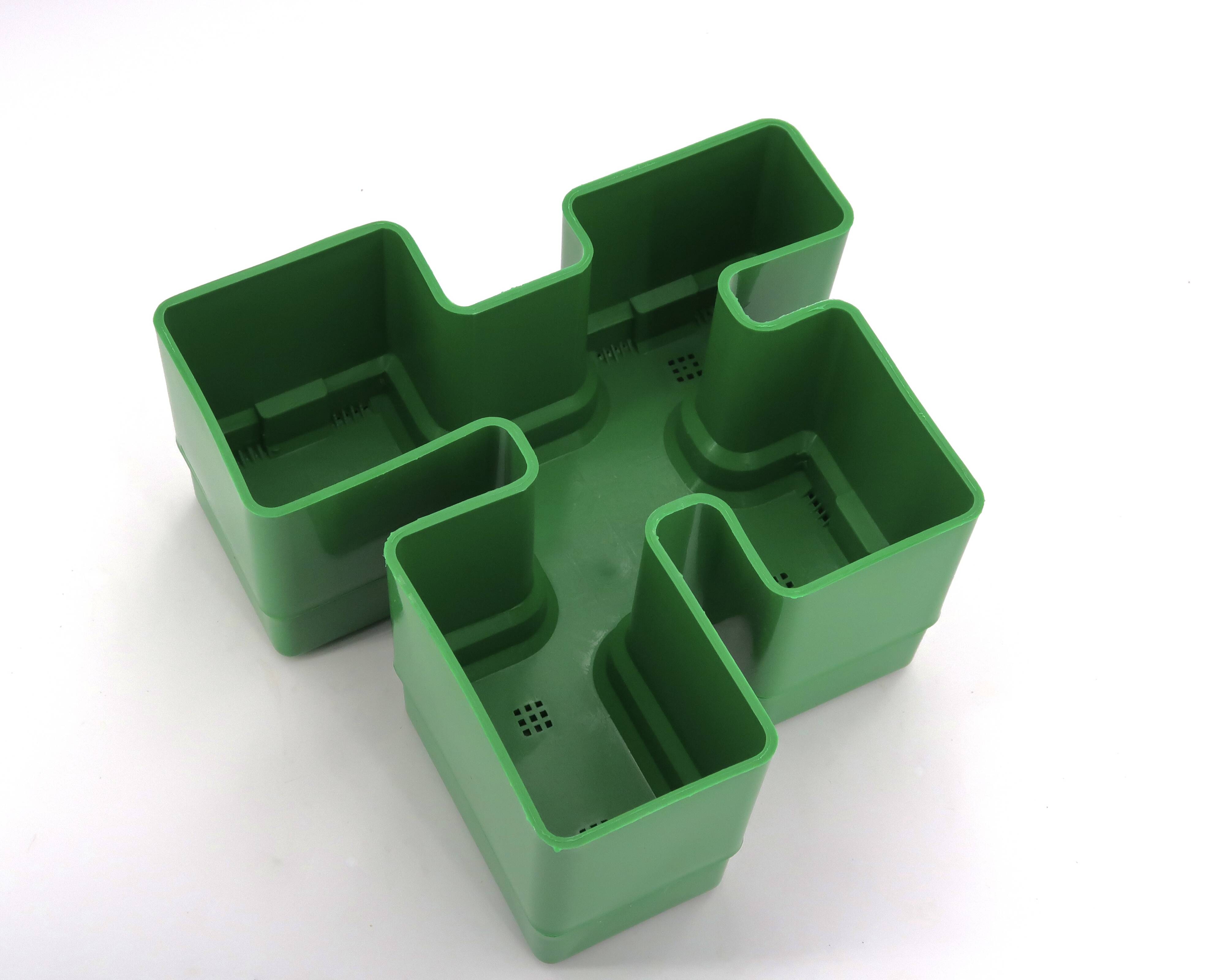 Vastill green plastic planter by Michael McCann