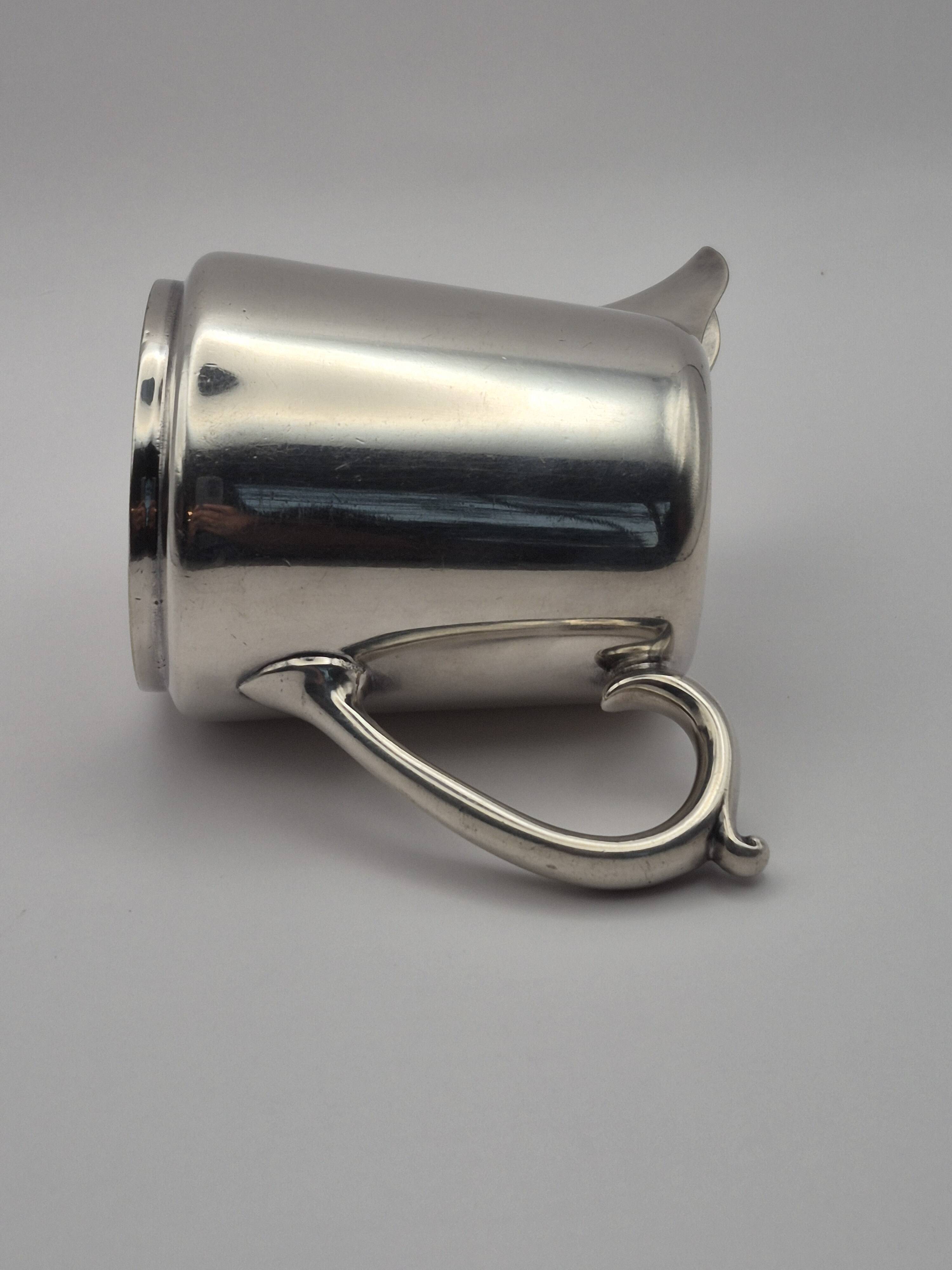 Superb vintage cream jug from the prestigious silversmithing house.