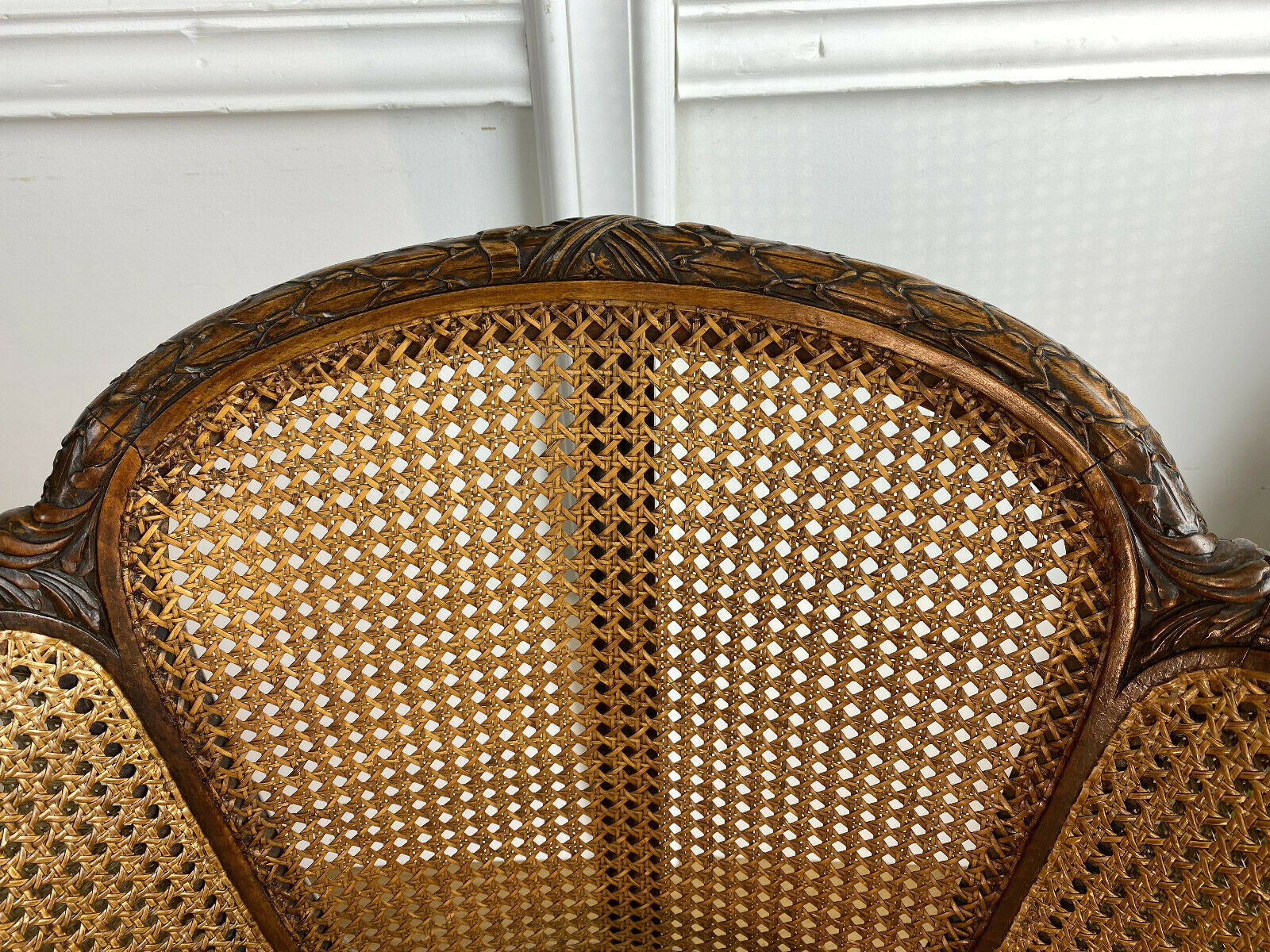 Old armchair with double cannage in walnut carved style Louis XVI of the nineteenth century