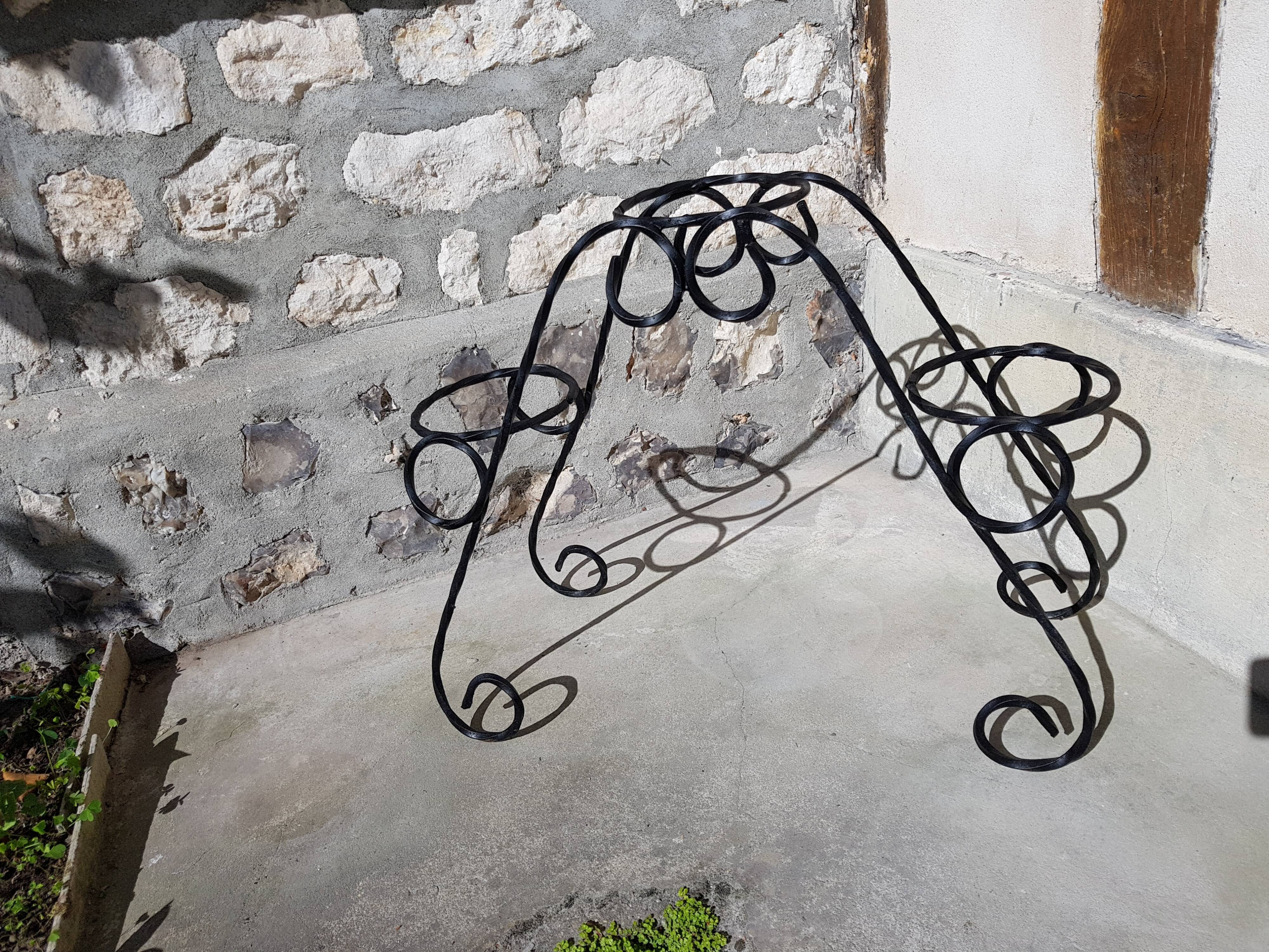 Black wrought iron plant holder