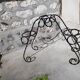 Black wrought iron plant holder