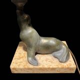 Lamp representing a seal on a marble base