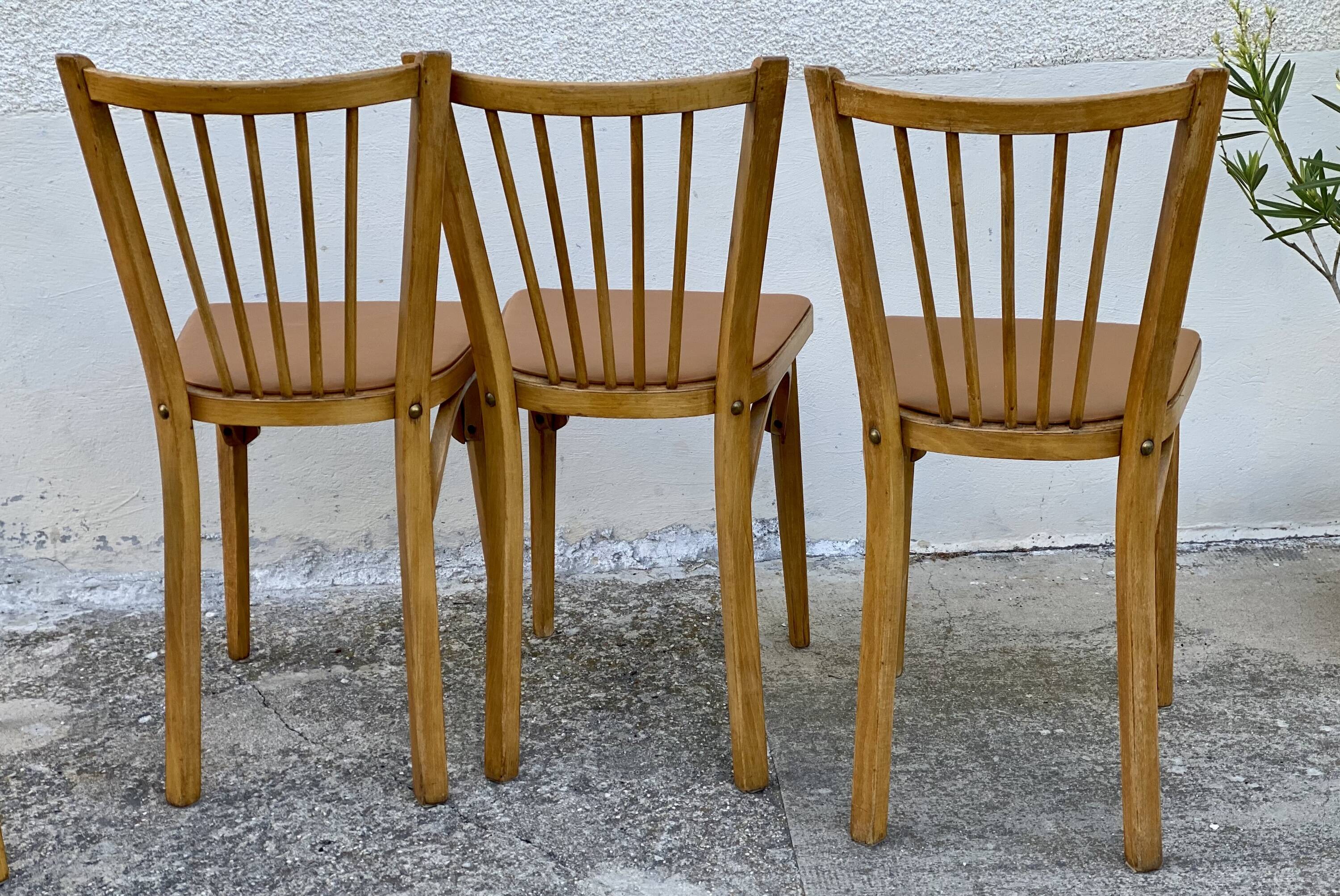 Série de 4 chaises bistros vintage 1950-60 assises Skaï