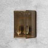 Wall sconce in brass and glass