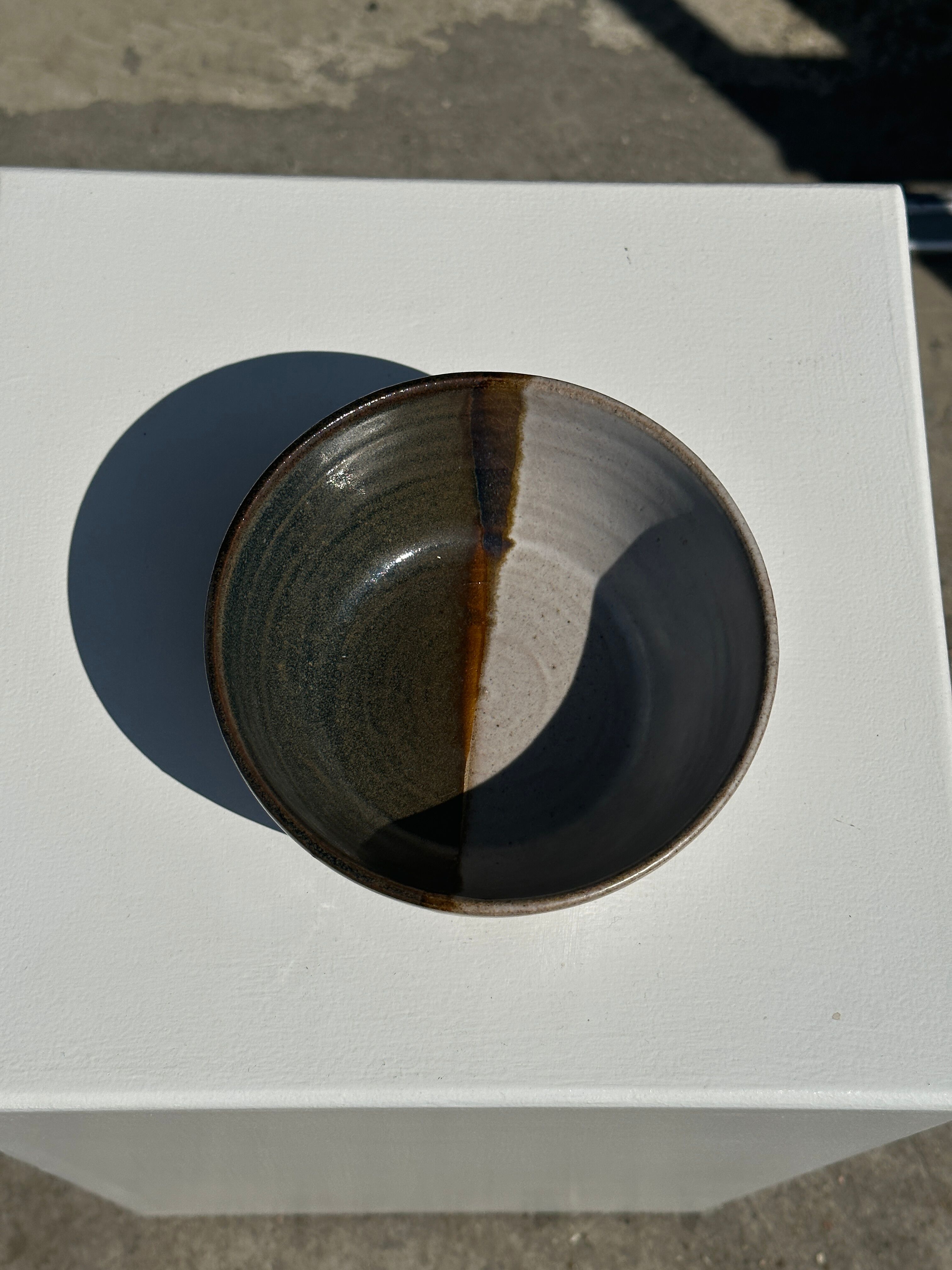 White and glossy brown two-tone ceramic bowl, matt earth