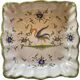 Petit plat décoratif carré et creux en porcelaine de Moustiers