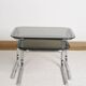 Pair of nesting tables in smoked glass and chrome legs.