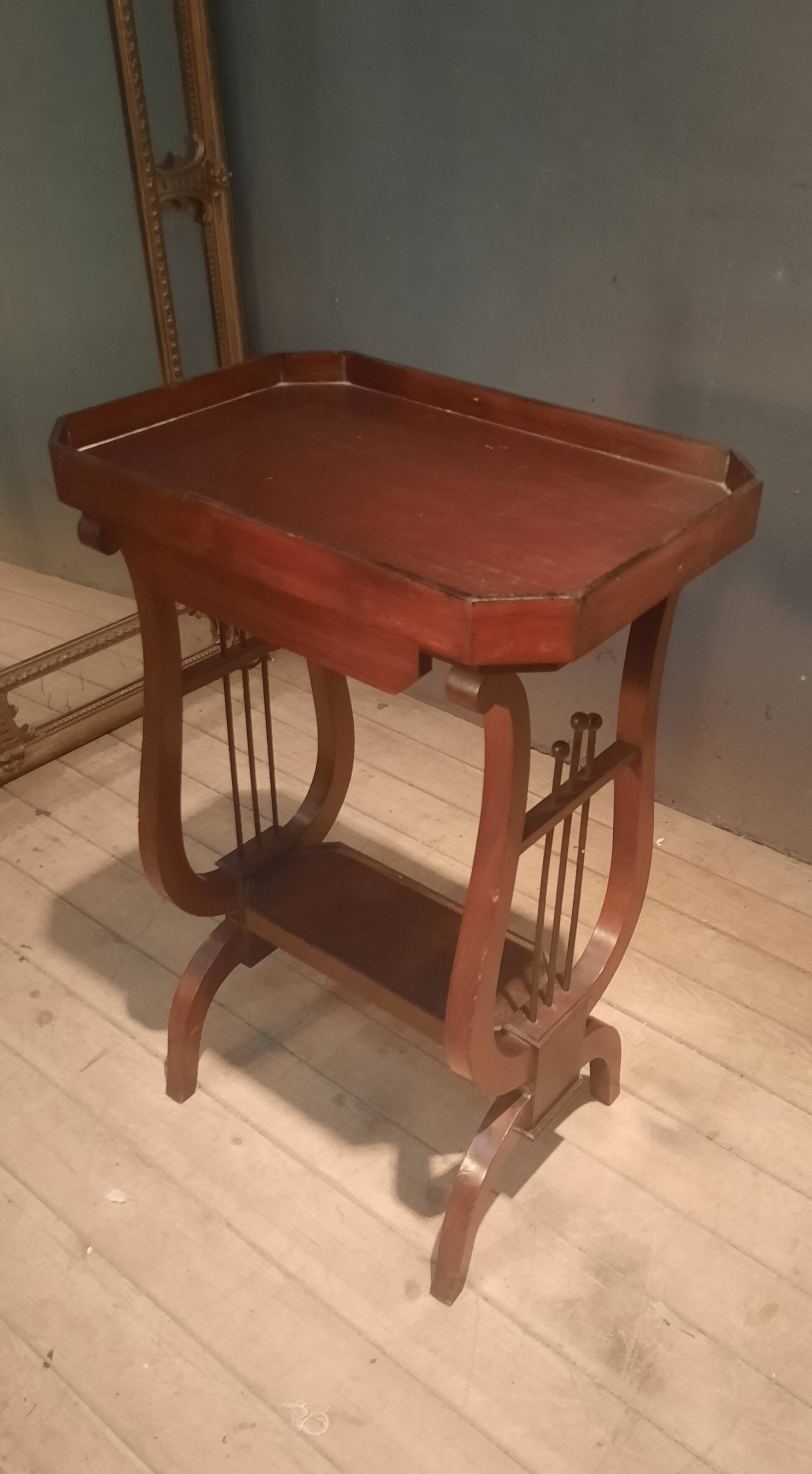 19th-century worker with a lyre footstool.
