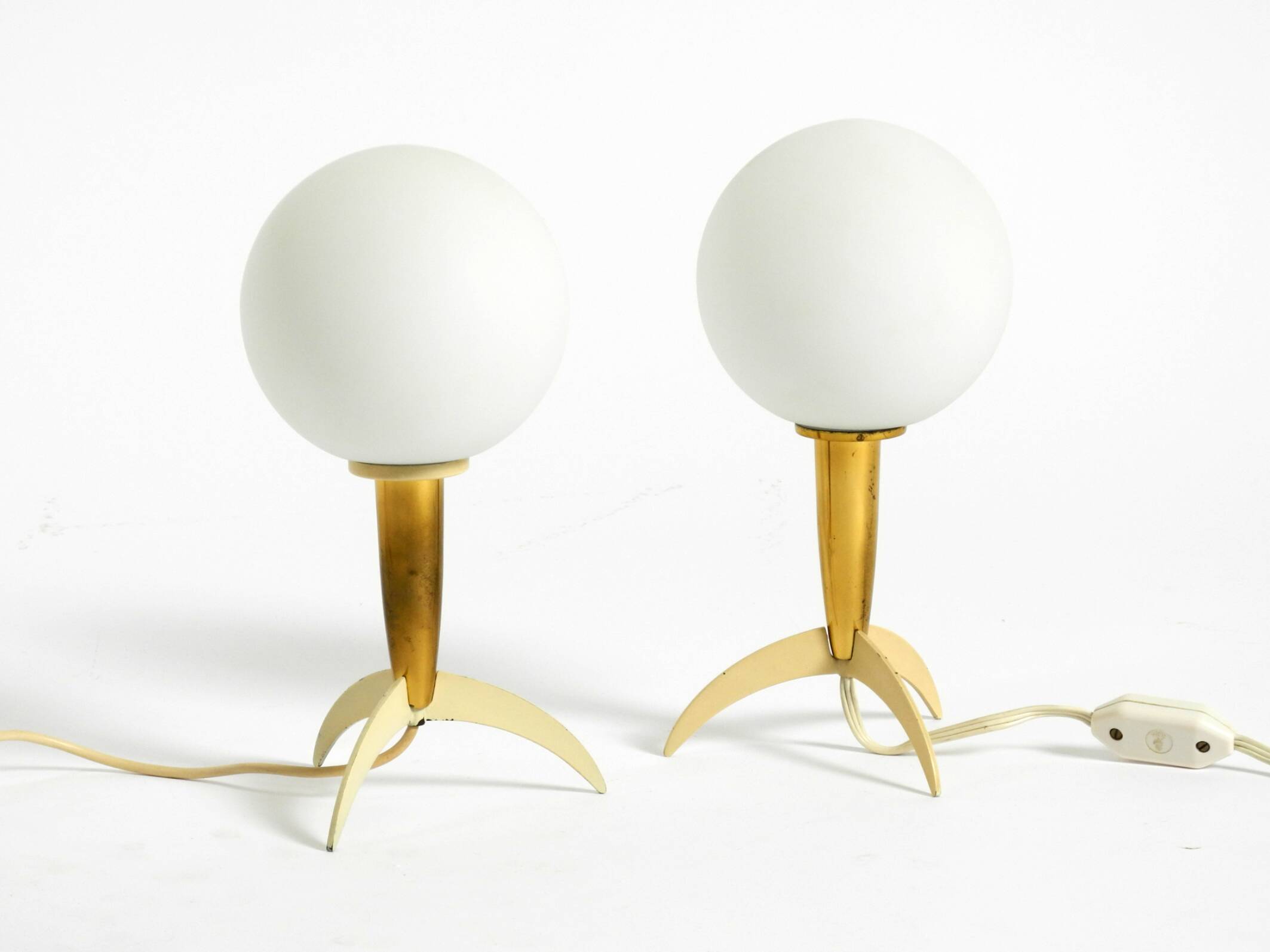 Two Mid-Century Modern rocket table lamps in brass and glass