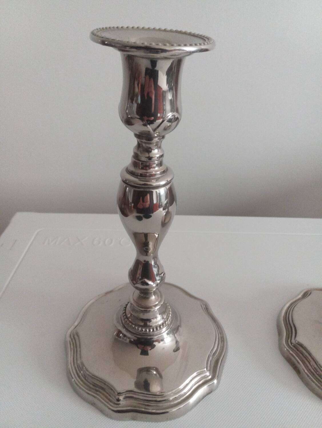 Pair of silver-plated metal candlesticks