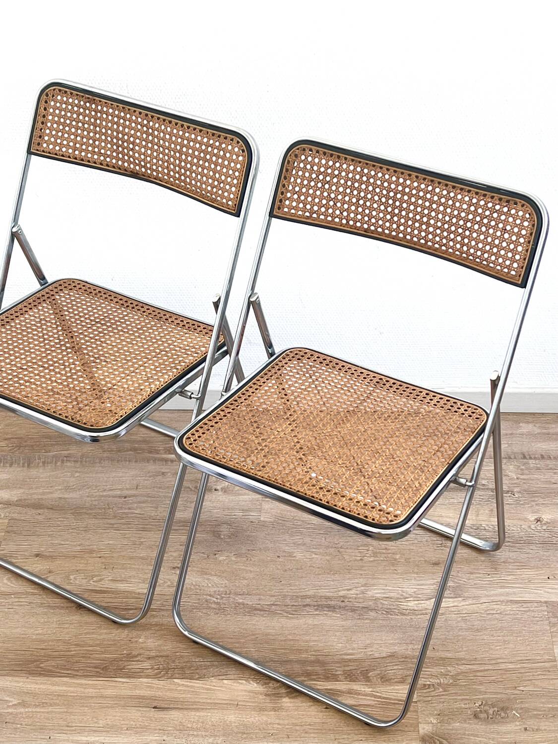 Pair of folding cane chairs