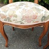 Pair of Louis XV chairs in carved walnut.