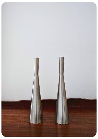 Pair of vintage brushed metal candlesticks