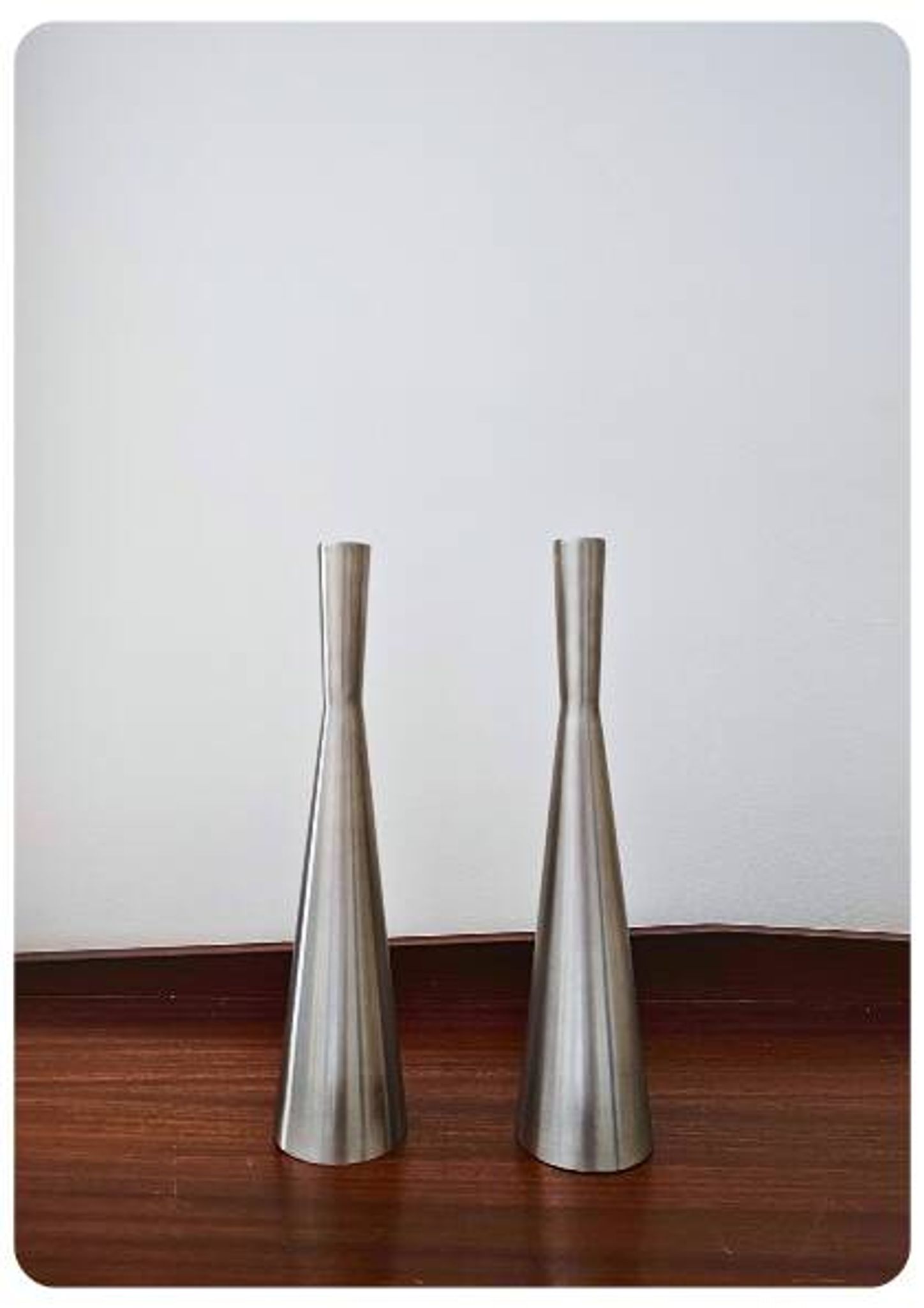Pair of vintage brushed metal candlesticks