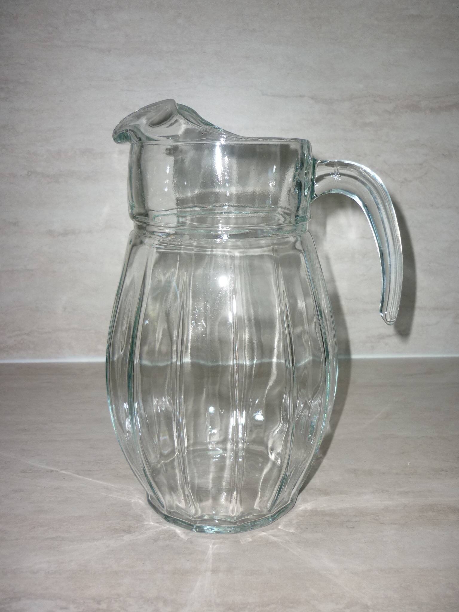 Vintage transparent molded glass carafe with handle