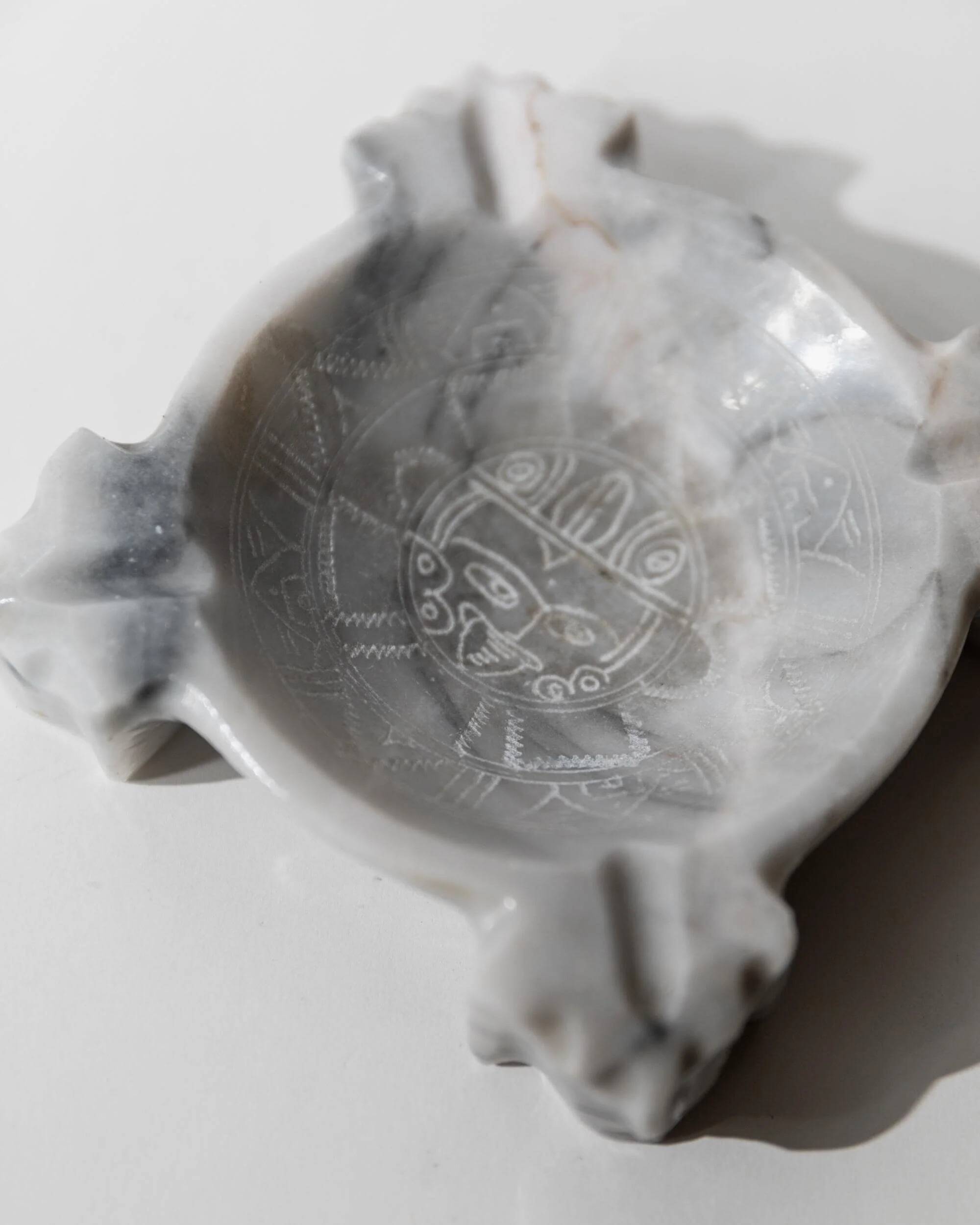 Vintage Mexican marble ashtray from the 1970s, engraved Aztec pattern.
