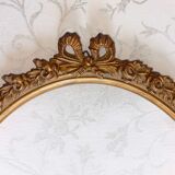 Oval frame with gilded pediments 19th wood and stucco