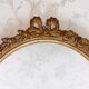 Oval frame with gilded pediments 19th wood and stucco