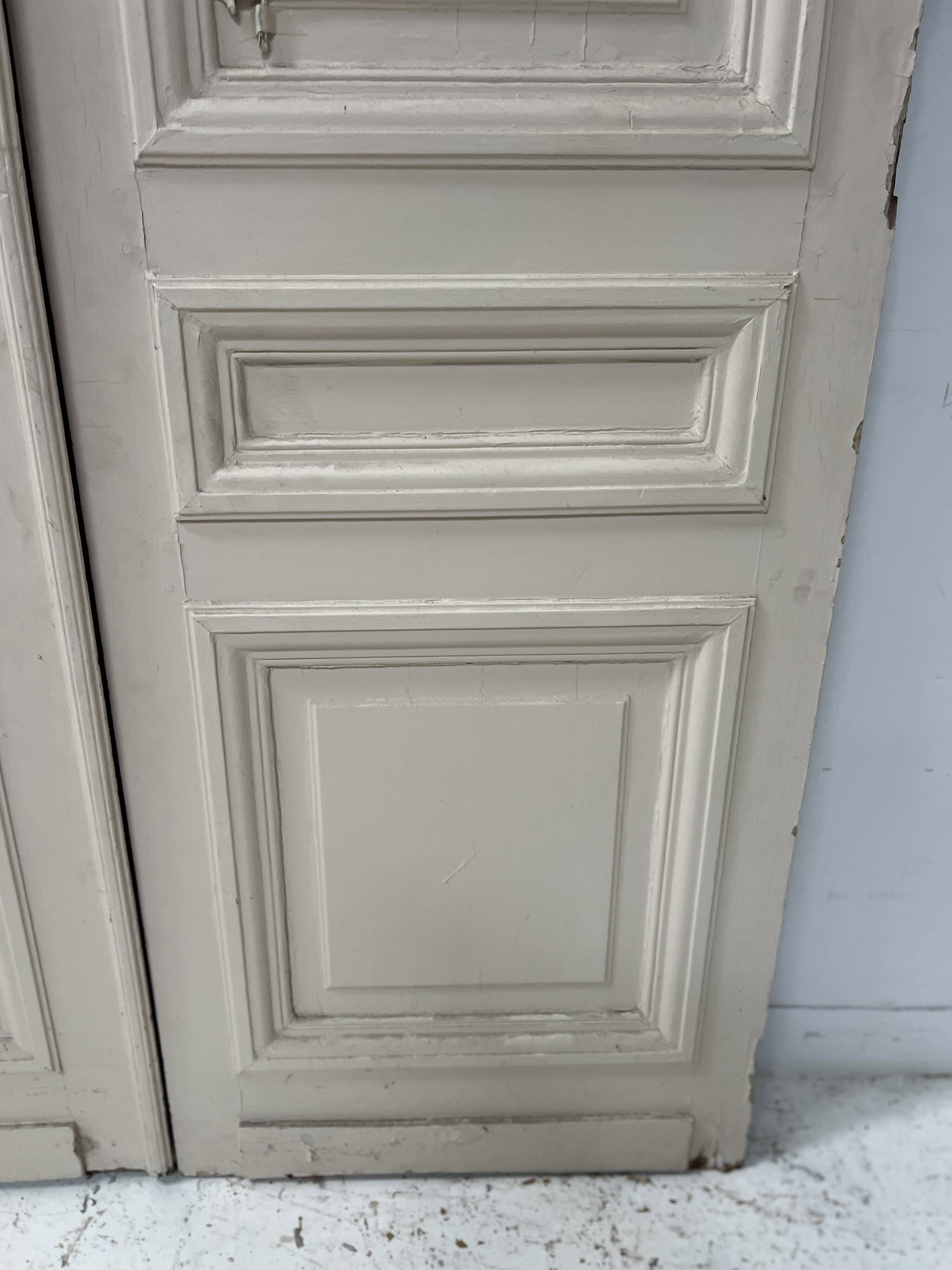 Pair of Haussmann-style double passage doors in patinated oak from the 19th century.