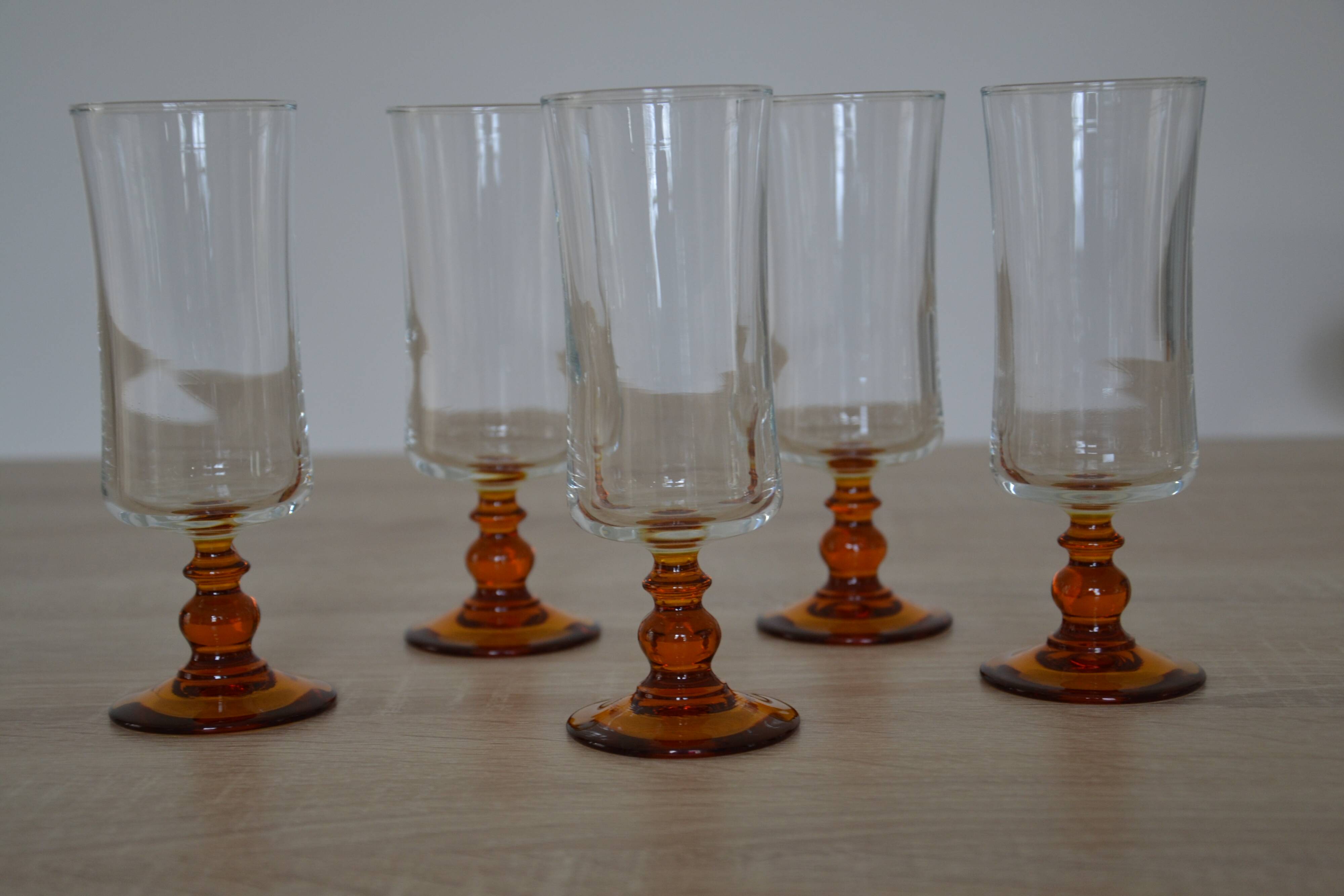 Champagne glasses with amber stems