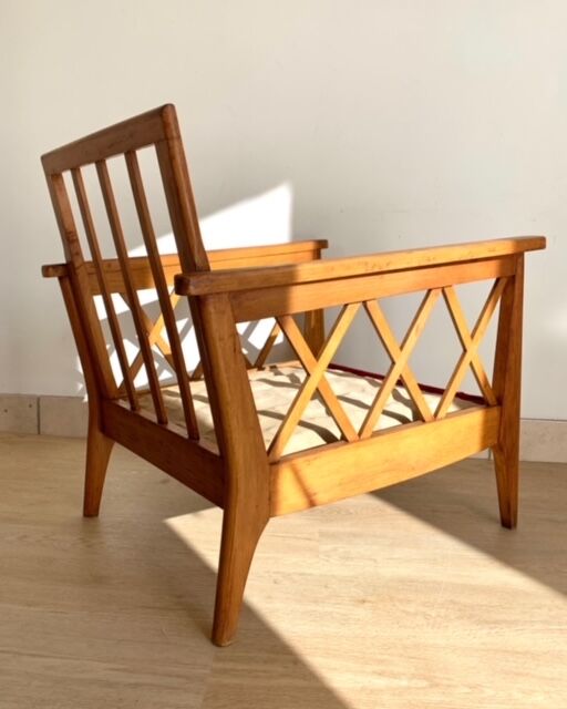 Pair of vintage wooden armchairs with braces
