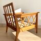 Pair of vintage wooden armchairs with braces