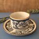 Large stoneware cup and saucer with delicate floral patterns