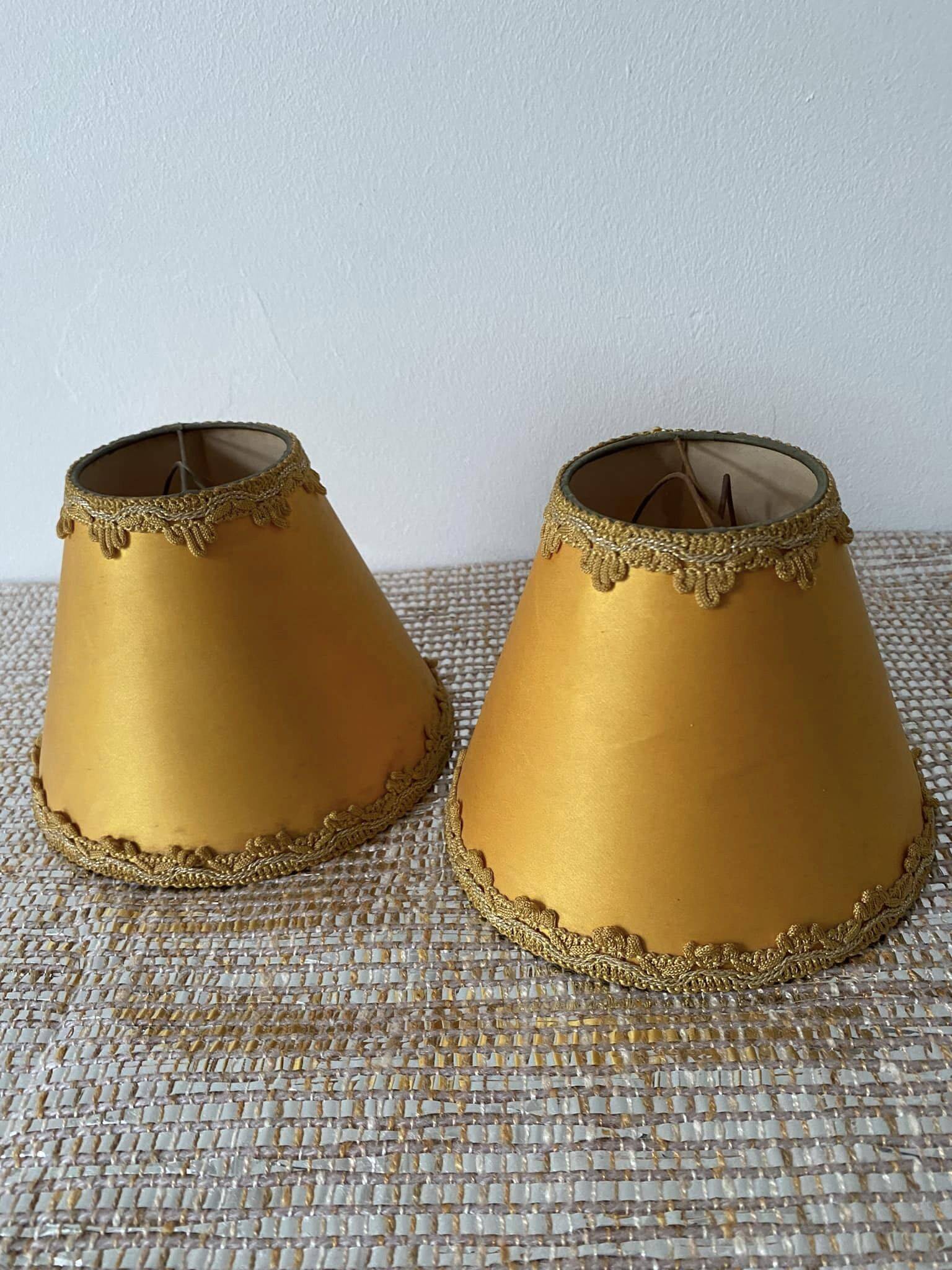 Pair of small old orange lampshades with trimmings