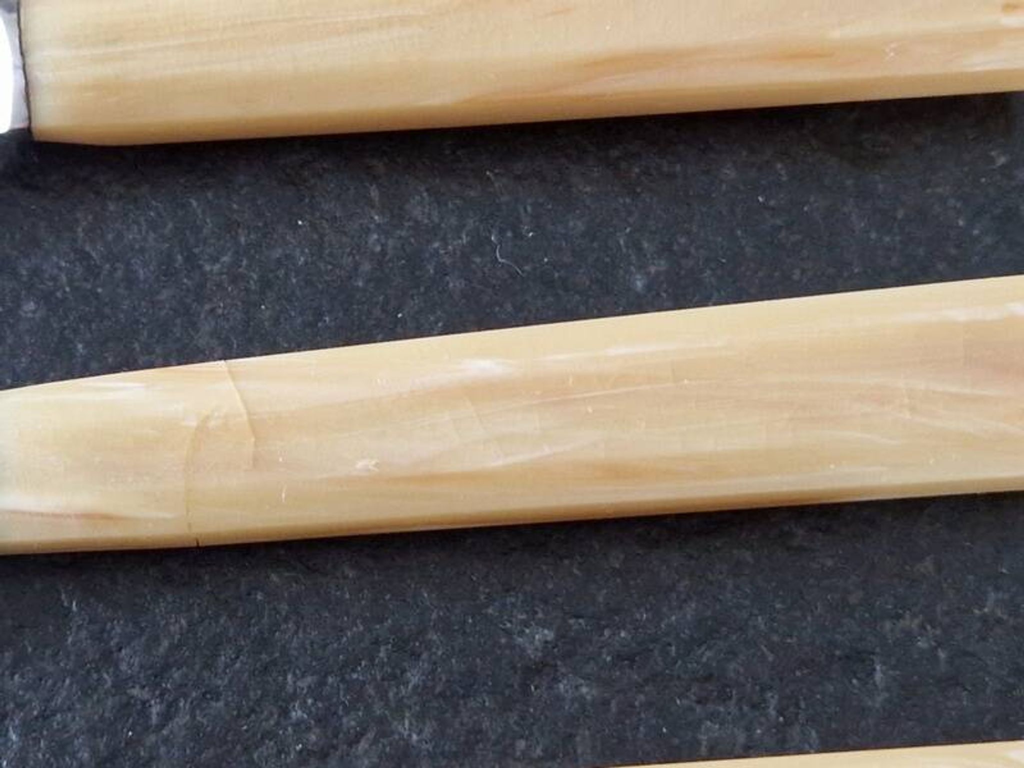 Philos - Set of 12 stainless steel dessert knives with bakelite handles.