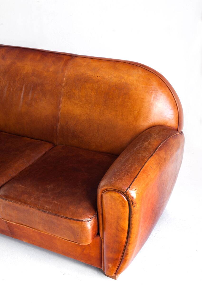 Vintage leather club sofa. Art Deco style. France, 1950s. (sofa convertible into bed)