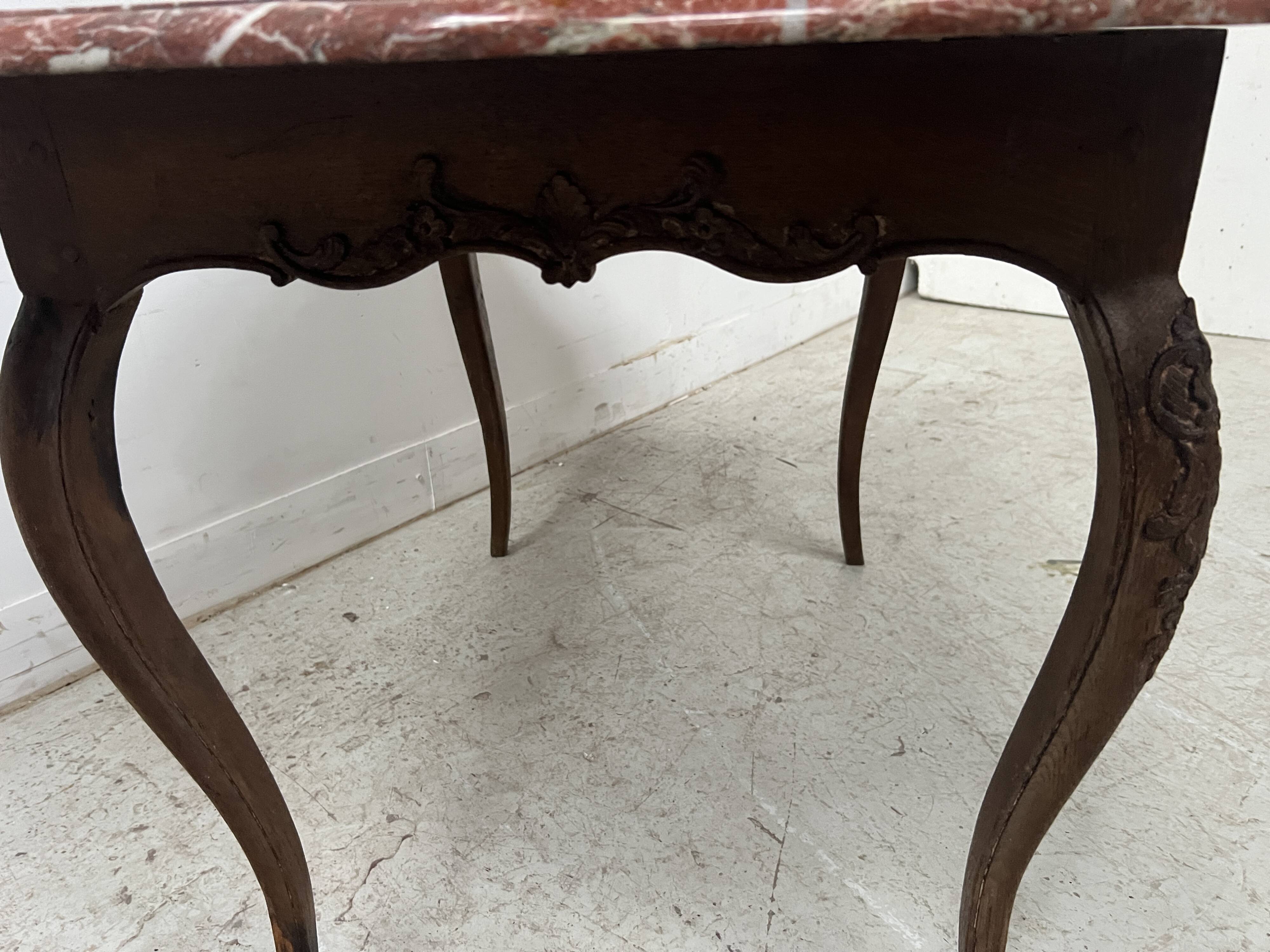Louis XV mid-table in oak and marble, 18th century.